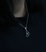 Silver women's necklace with loop symbol