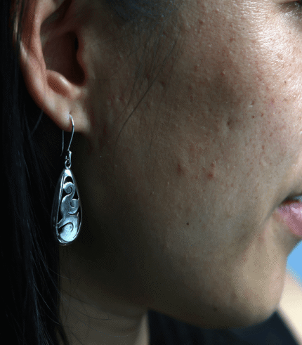 Woman wearing the Tear Drop Earrings-Papel Picado