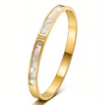 gold bangle bracelet with white inlay and CZ crystals in 18K gold plated stainless steel