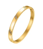 gold bangle bracelet with diagonal CZ crystal accents in 18K gold plated stainless steel