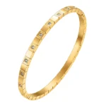 gold bangle bracelet with square tile pattern and CZ crystals in 18K gold plated stainless steel