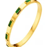 gold bangle bracelet with green rectangular crystals
