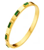 gold bangle bracelet with green rectangular crystals