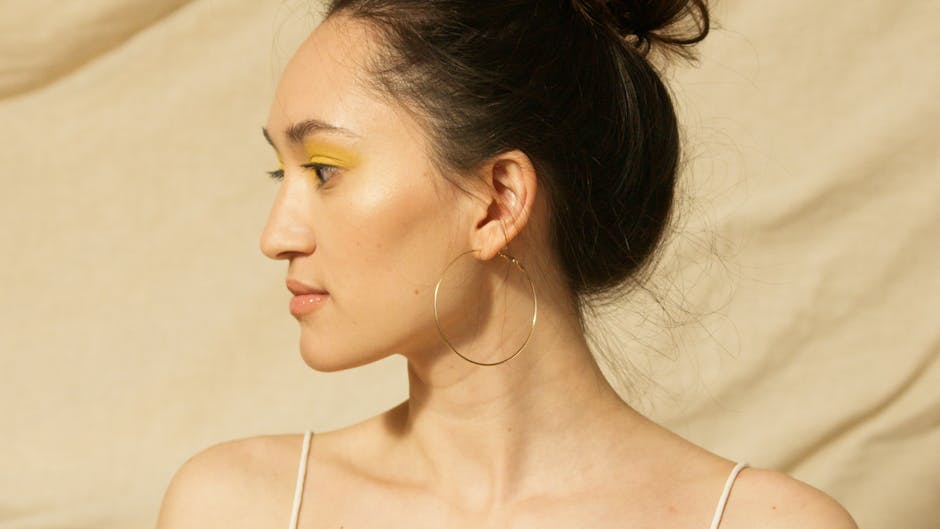 gold evil eye pendant necklace on twisted gold chain in 18K gold plated stainless steel